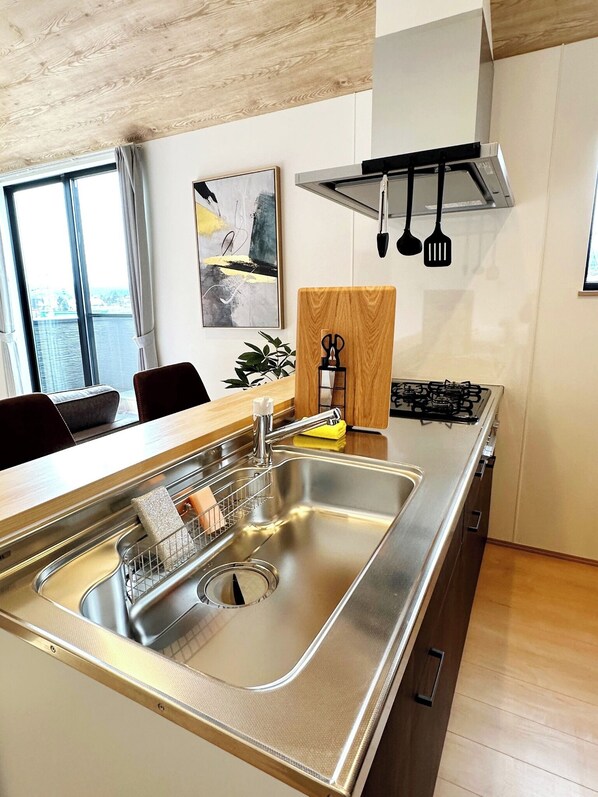The sink is spacious and makes washing dishes easy.