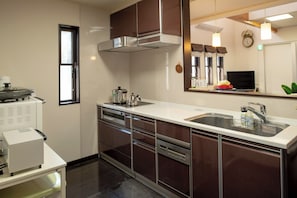 The clean kitchen allows you to look over to the living room even while preparing meals, so you can share moments of family time together.