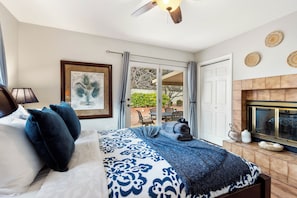 Queen bed, Smart TV, dresser and nightstand. Bright and airy with sliding door access to the backyard and a shared bathroom.