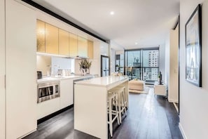 Spacious kitchen and dining area can accomodate up to 6