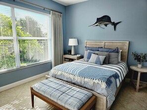 Back guest bedroom with queen and sliders to pool