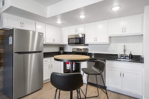 The airy eat-in kitchen offers ample storage & every home comfort