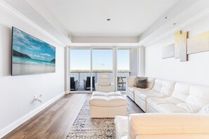 Bright living area with sectional sofa and Smart TV