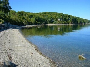 The pebbly beach in front of the property is just for the residences in the neighborhood