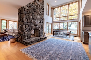 Open dining and kitchen area with views. There are 4 points of access to the deck from the main level. Fireplace is not usable.