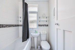 Bathroom with complimentary toiletries provided.