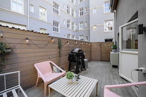Stylish patio furniture and a built-in grill for your next get-together.