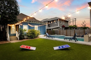 Sunshine, good vibes, and a friendly game of corn hole by the pool! Nothing beats summer fun in the backyard!
