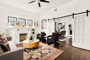 There's nothing like gathering around the fireplace in this stunning living room. Perfect for creating memories and enjoying quality time with loved ones.
