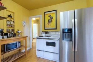 Charming, compact kitchen with a vintage, electric range.