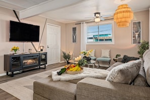 Cozy up by the fireplace in this inviting living room.