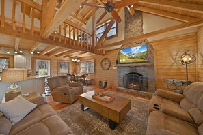 Living Room with Comfy Leather Furniture and Exposed Beam Tongue and Groove Ceiling