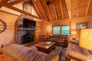 Living Room with Comfy Leather Furniture and Exposed Beam Tongue and Groove Ceiling