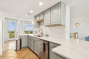 Luxury Kitchen with Quartz Countertops and Stainless Steel Appliances