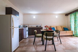 Relax in this bright, open-plan living area. Dining included!
