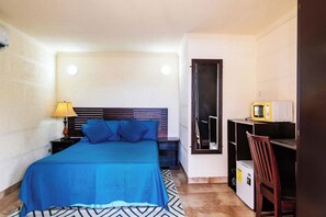 Relax in your cozy queen bed. Enjoy TV & AC!