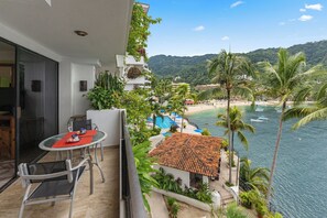 Enjoy the view from your private balcony with outdoor seating.