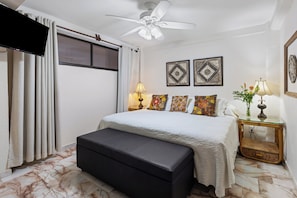 Stylish bedroom featuring a king bed and cozy ambiance.