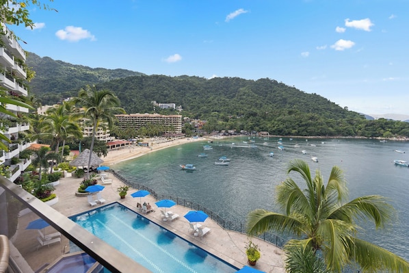 Stunning shared pool with ocean views perfect for relaxation.