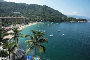 Stunning views of the ocean and lush hills create the perfect setting.