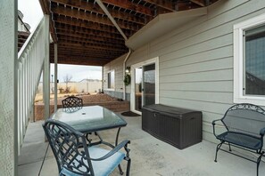 Relax on the covered patio, complete with outdoor seating and a spacious backyard, perfect for enjoying the fresh air.






