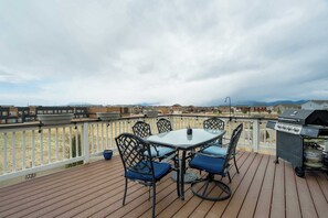Expansive outdoor deck with a dining set and BBQ grill, offering stunning mountain views. Perfect for enjoying meals, morning coffee, or evening sunsets while taking in the Colorado scenery!.