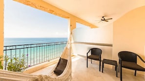 Relax on your oceanfront balcony at Garza Blanca Puerto Vallarta with hammock.