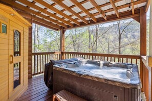 Enjoy your private hot tub with mountain views.