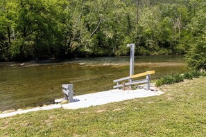 Easy river access directly from the cabin's grassy yard.