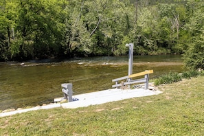 Easy river access directly from the cabin's grassy yard.
