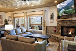Cozy up by the fire with stunning mountain views