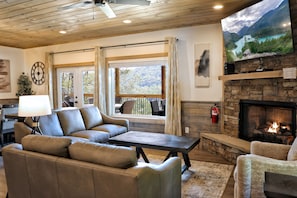 Cozy up by the fire with stunning mountain views