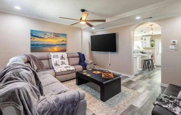 "Kick back with a 70” smart TV, plush seating, and room for the whole group."