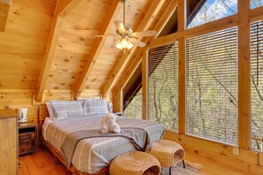 Lofty bedroom with high ceilings, offering space and serenity for deep rest.