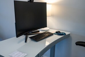 The entertainment room also has a  desk/chair.