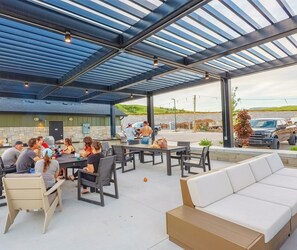 Community BBQ area with tables for enjoying your meals.