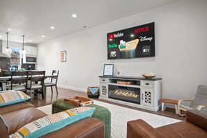 Plush seating, expansive smart TV, fireplace for relaxing in the evenings.