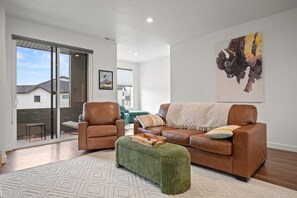 Sliding glass doors lead to the enclosed balcony.