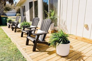 sun soaked deck with adirondacks