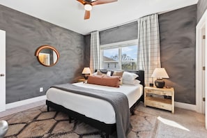 Bedroom 2 is upstairs with a king bed, smart TV, room darkening shades, closet space and private ensuite bathroom.