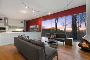 Enjoy breathtaking mountain scenery from every angle in this modern retreat, where natural light floods the space and brings the outdoors in.