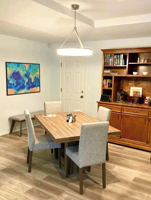 The table in the open-concept living room/dining room seats six.
