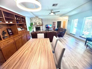The table in the open-concept living room/dining room seats six.