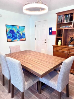 The table in the open-concept living room/dining room seats six.