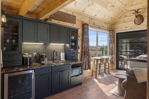 The sleek kitchenette offers ample space & great amenities
