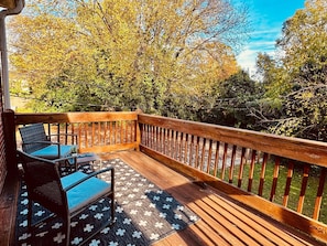 Take in the sunshine and fresh air on this spacious deck with comfy seating. A peaceful retreat for morning coffee or evening relaxation!