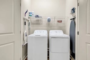 Washer/Dryer, Iron and board plus cleaning supplies