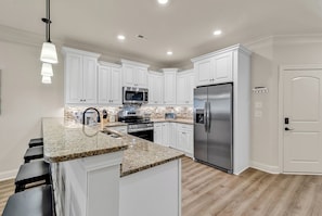 Fully stocked, gourmet kitchen
