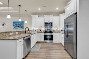 Fully stocked, gourmet kitchen