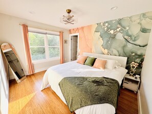 Relax in the "Terra" geode-inspired guest room, where shimmering tones and a luxurious king bed evoke the beauty of a hidden gem.